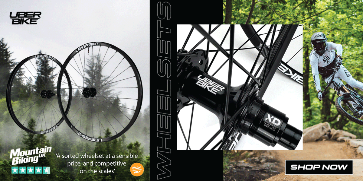 A bike wheelset with a hub and review showing 5 stars and a bike rider 