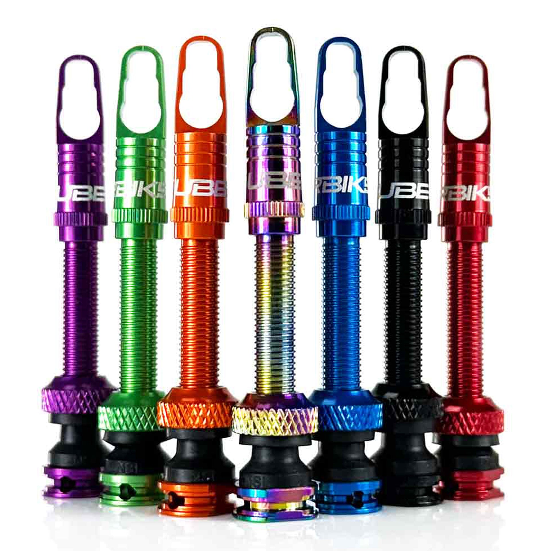 Set of colourful bike valves on a white background
