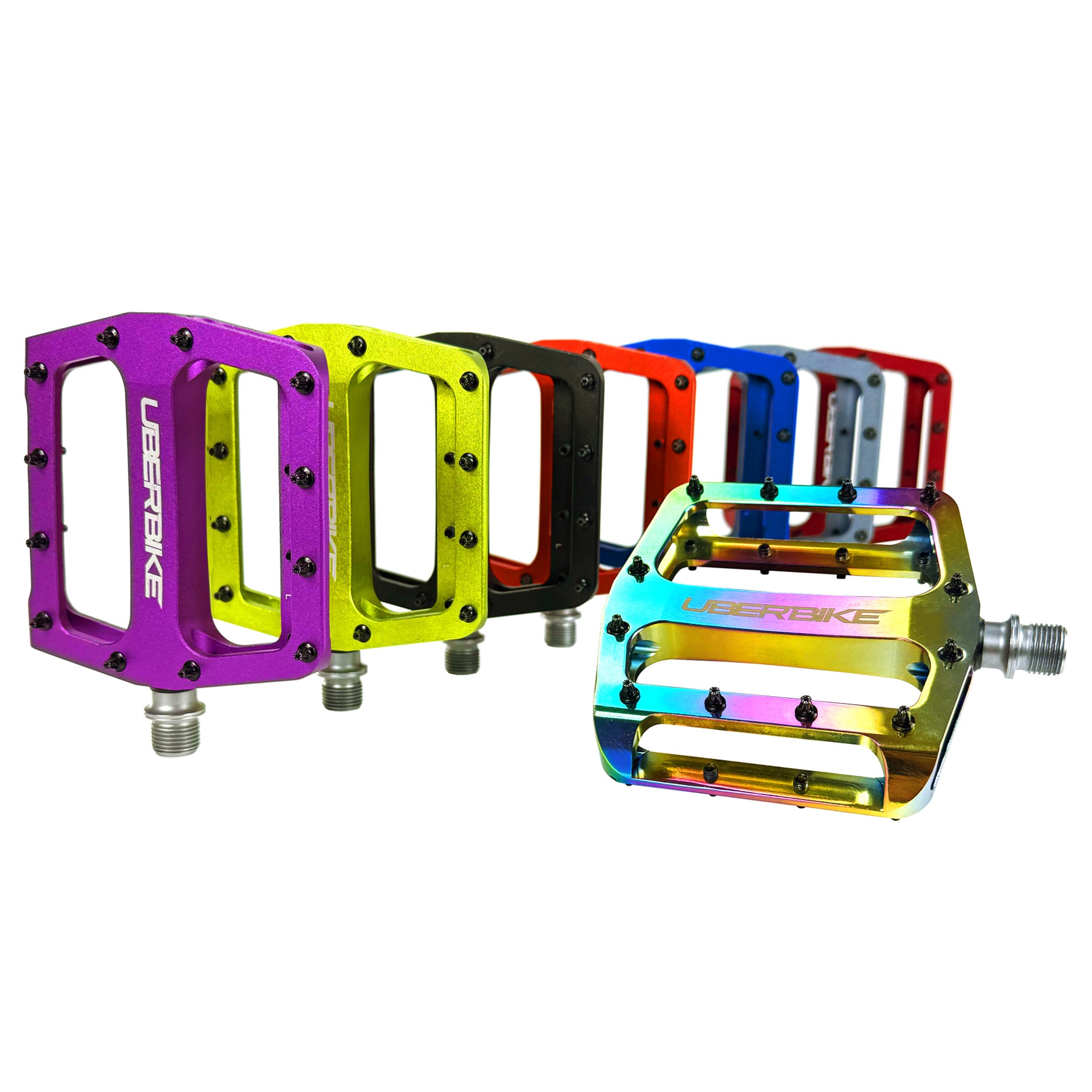 8 various colours of alloy pedals with Uberbike branding on a white background