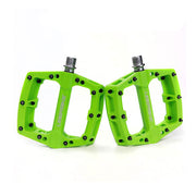 green mtb composite pedal with Uberbike branding on a white background
