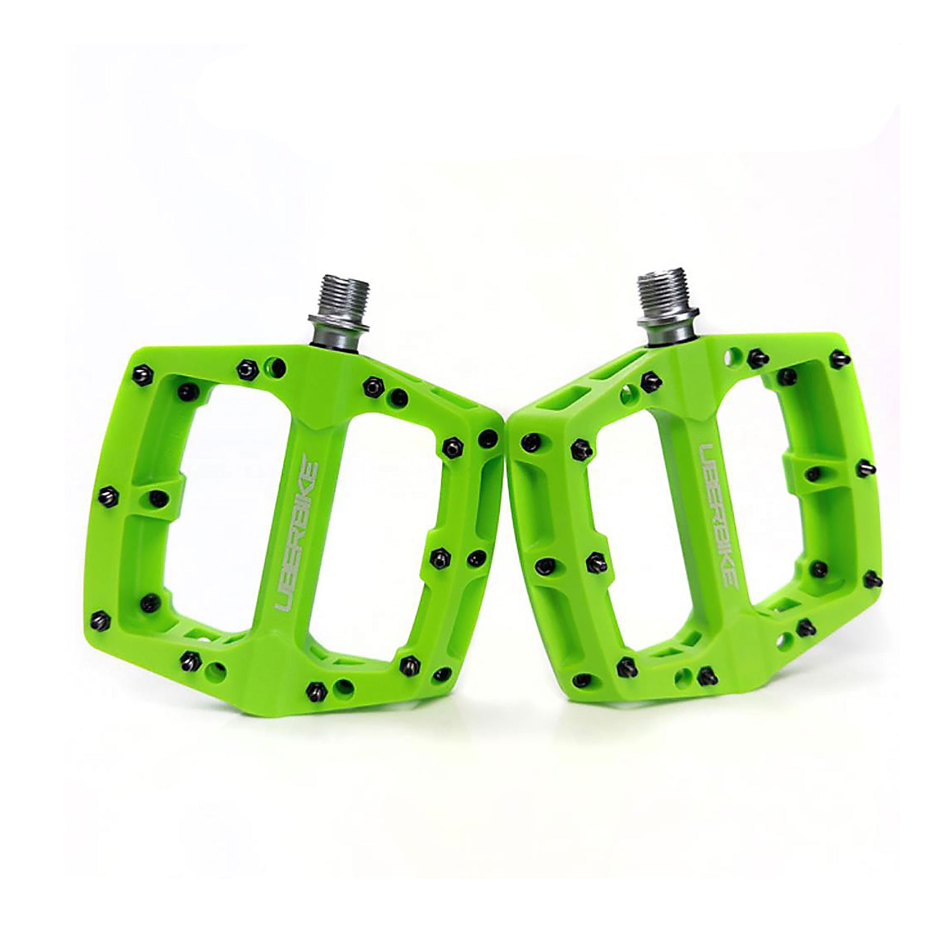 green mtb composite pedal with Uberbike branding on a white background
