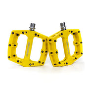 yellow mtb composite pedal with Uberbike branding on a white background