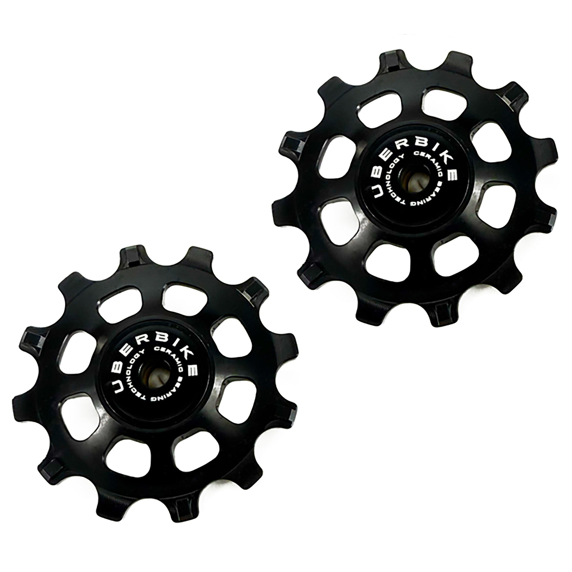 Two black bicycle pulley wheels with 'UBERBIKE' branding on a white background