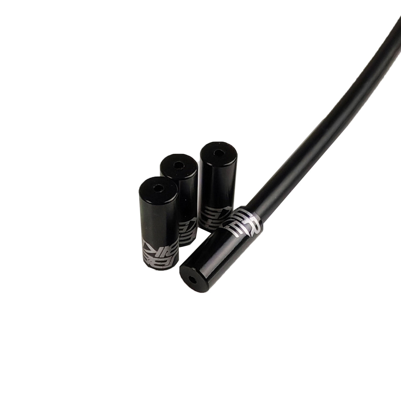 black Uberbike branded gear ferrules on a white background