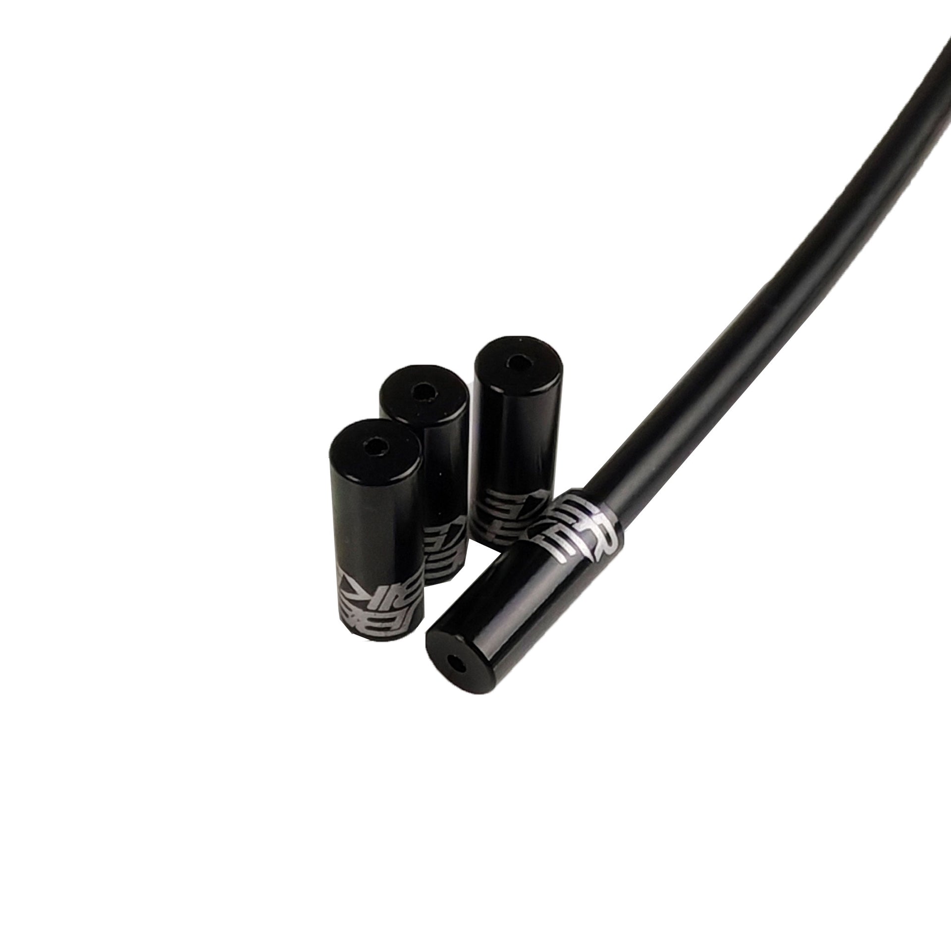 black Uberbike branded gear ferrules on a white background