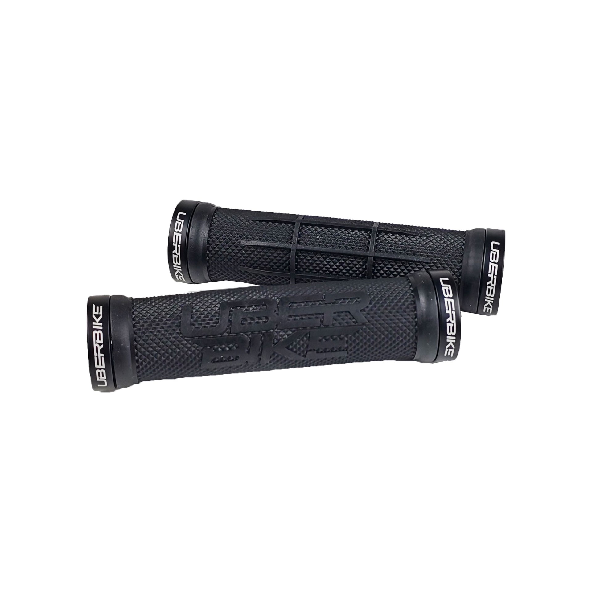 2 black half waffle grip mountain bike grips with uberbike branding and black lockrings on a white background