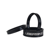3 black headset spacers with Uberbike branding on a white background