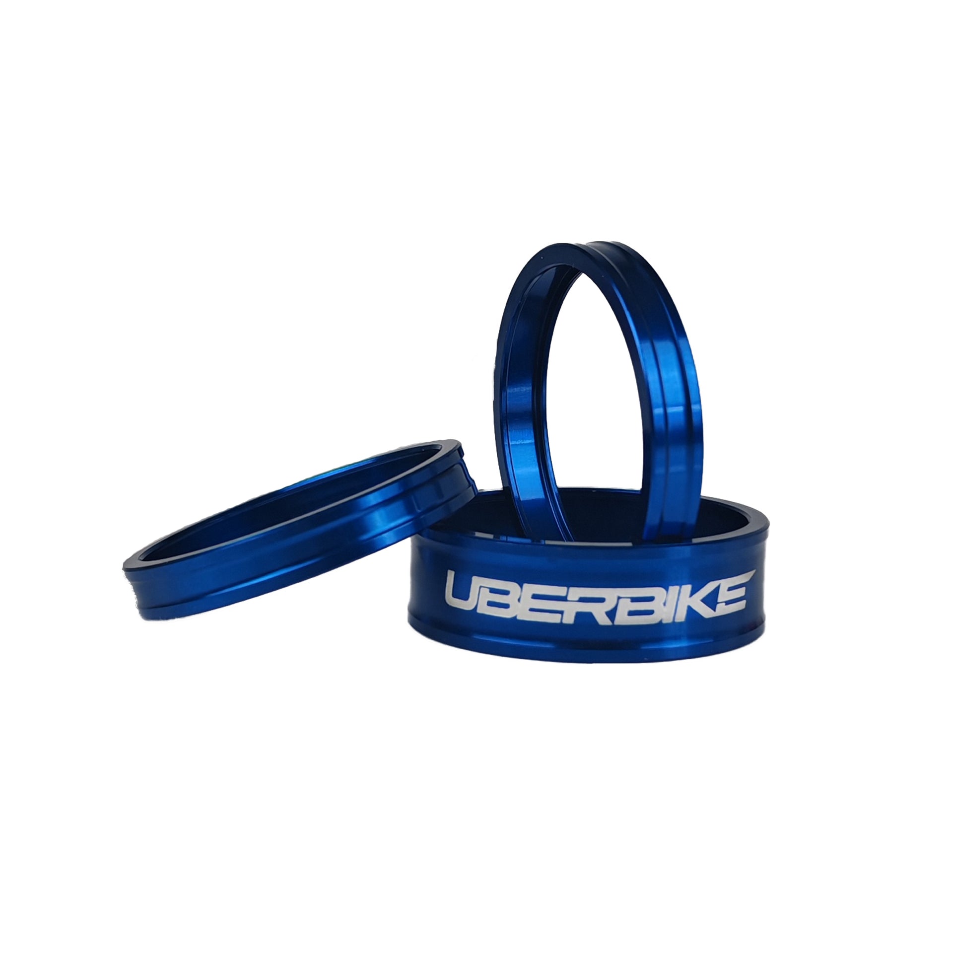 3 blue headset spacers with Uberbike branding on a white background