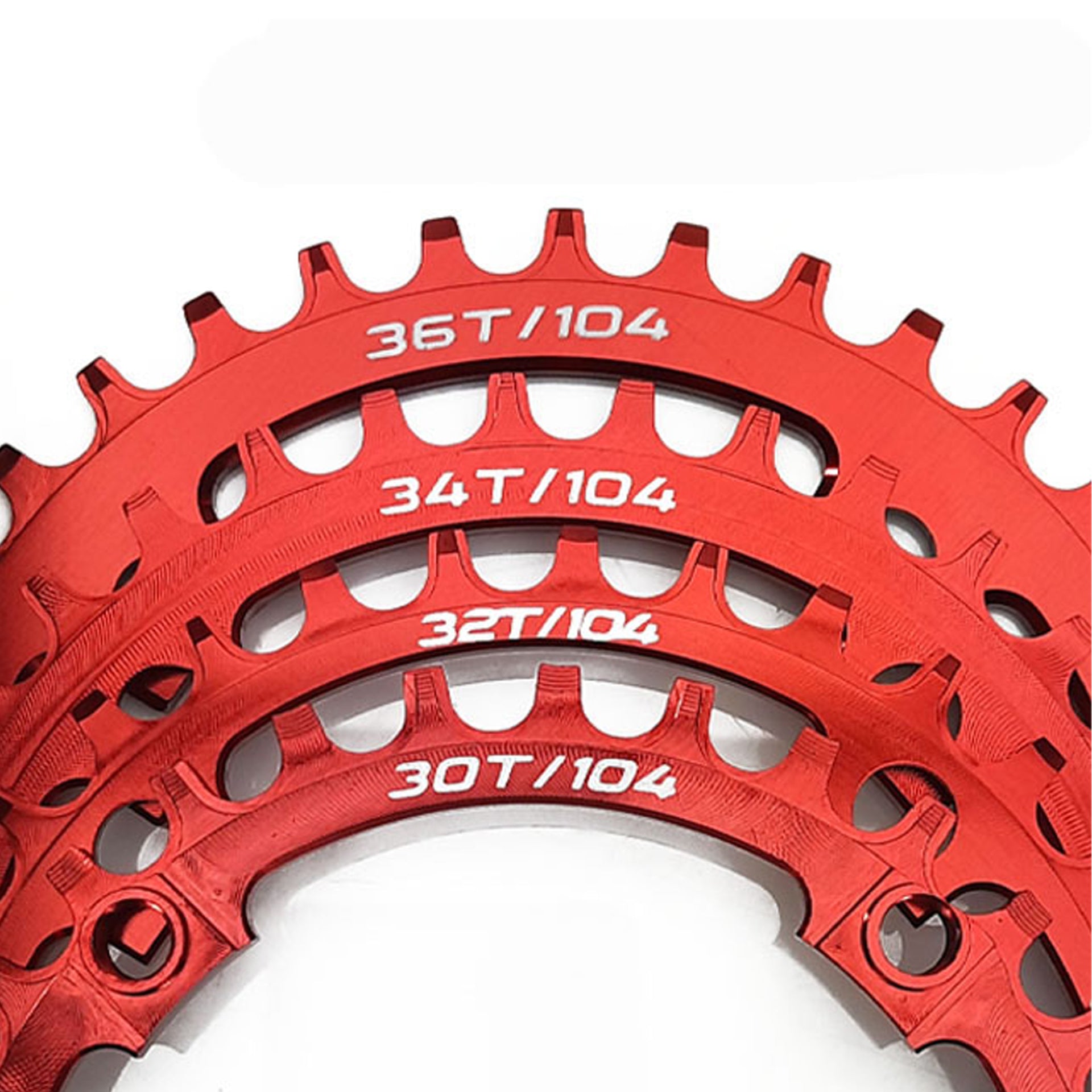 Red chainrings in various sizes on a white background