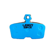 Brake pad inserts with 'UberBike' branding on a white background.