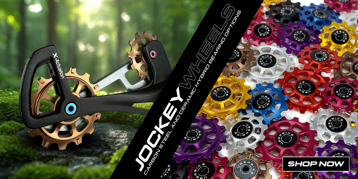 Jockey wheels in a derailleur and a variety of different coloured and sized jockey wheels