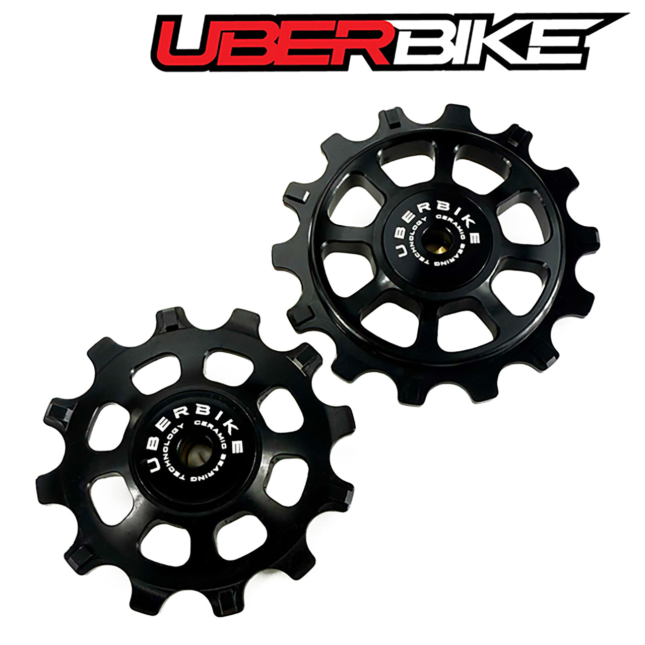 Two black Ceramic pulleys with 'Uberbike' branding on a white background.