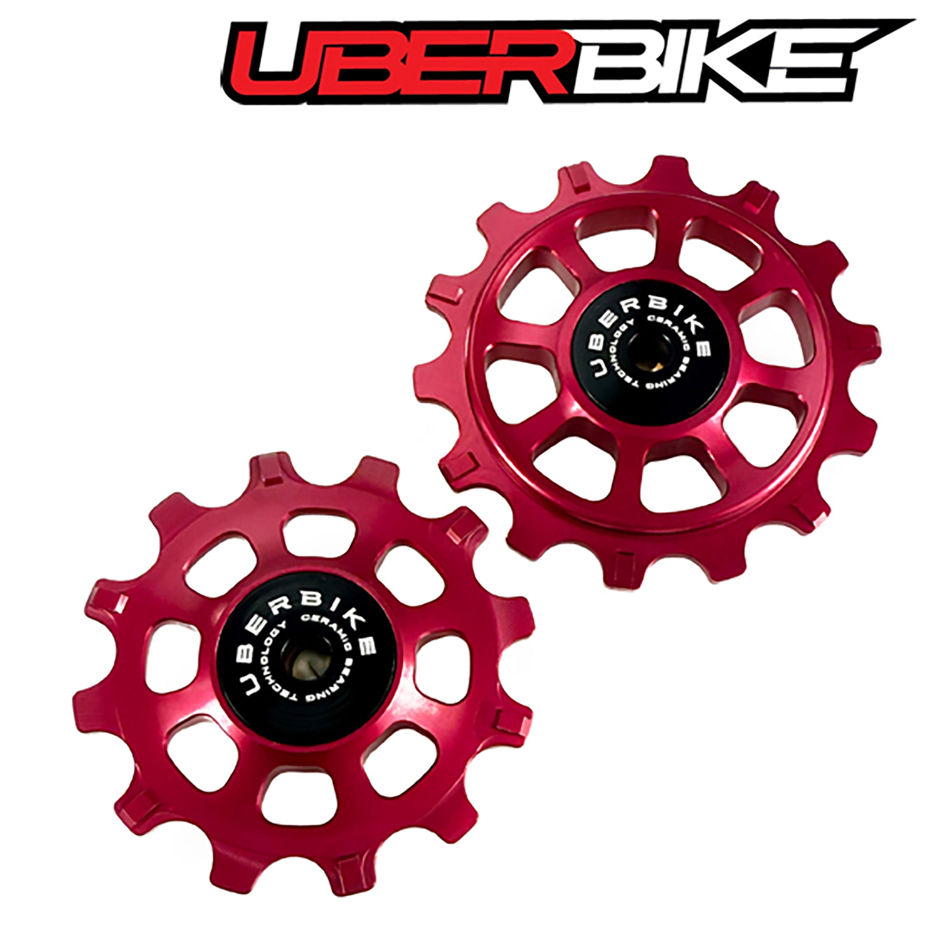 Two red ceramic pulley wheels with 'Uberbike' branding on a white background.