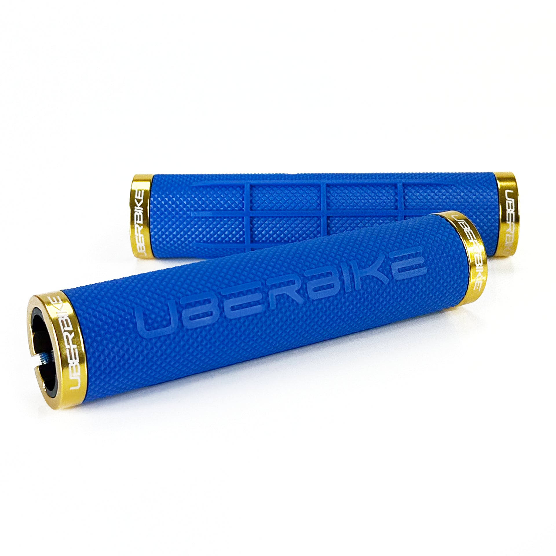two blue fat grip mountain bike grips and gold lockrings on a white background