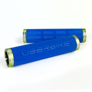 two blue fat grip mountain  bike grips and green lockrings on a white background