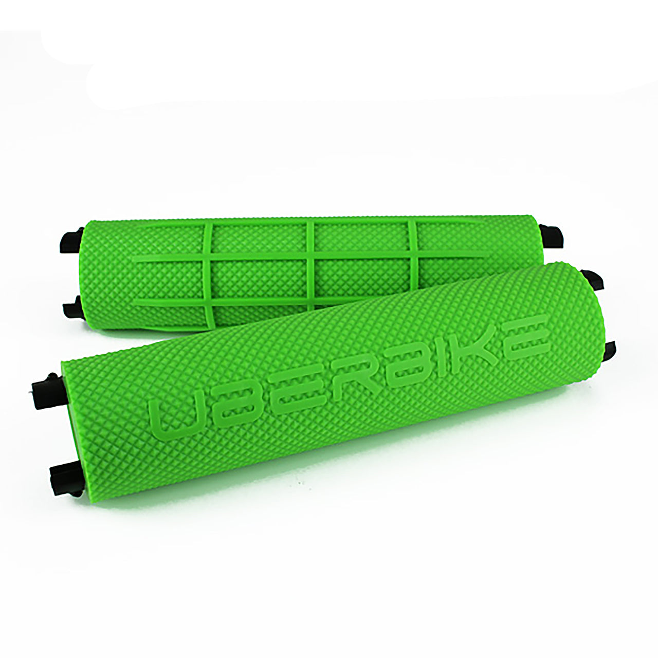 Two green bicycle handlebar grips with 'Uberbike' branding on a white background