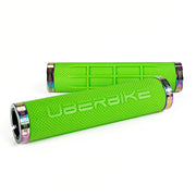 two green fat grip mountain  bike grips and oil slick lockrings on a white background