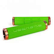 two green fat grip mountain  bike grips and orange lockrings on a white background