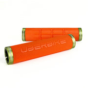 two orange fat grip mountain  bike grips and green lockrings on a white background