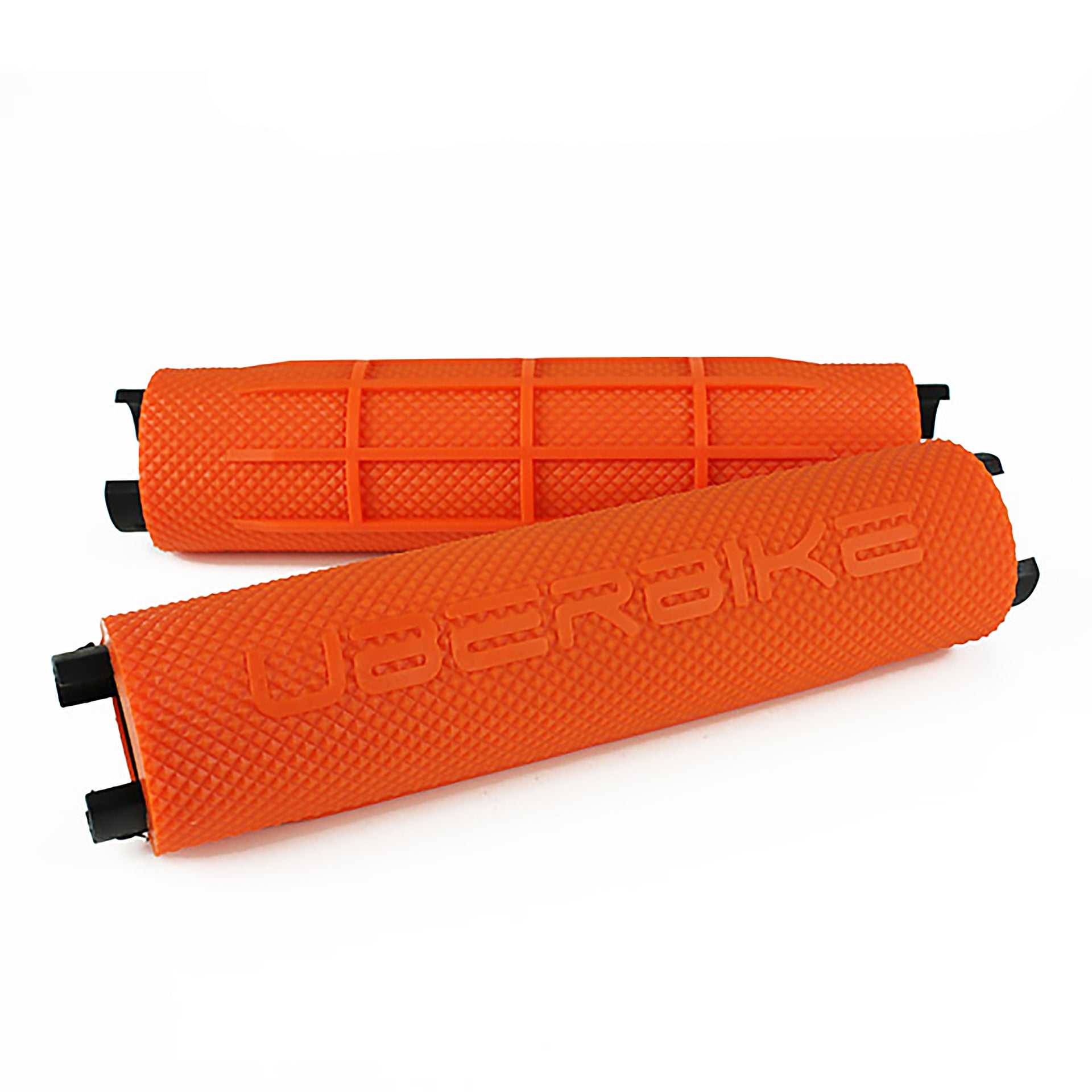Two orange bicycle handlebar grips with 'Uberbike' branding on a white background