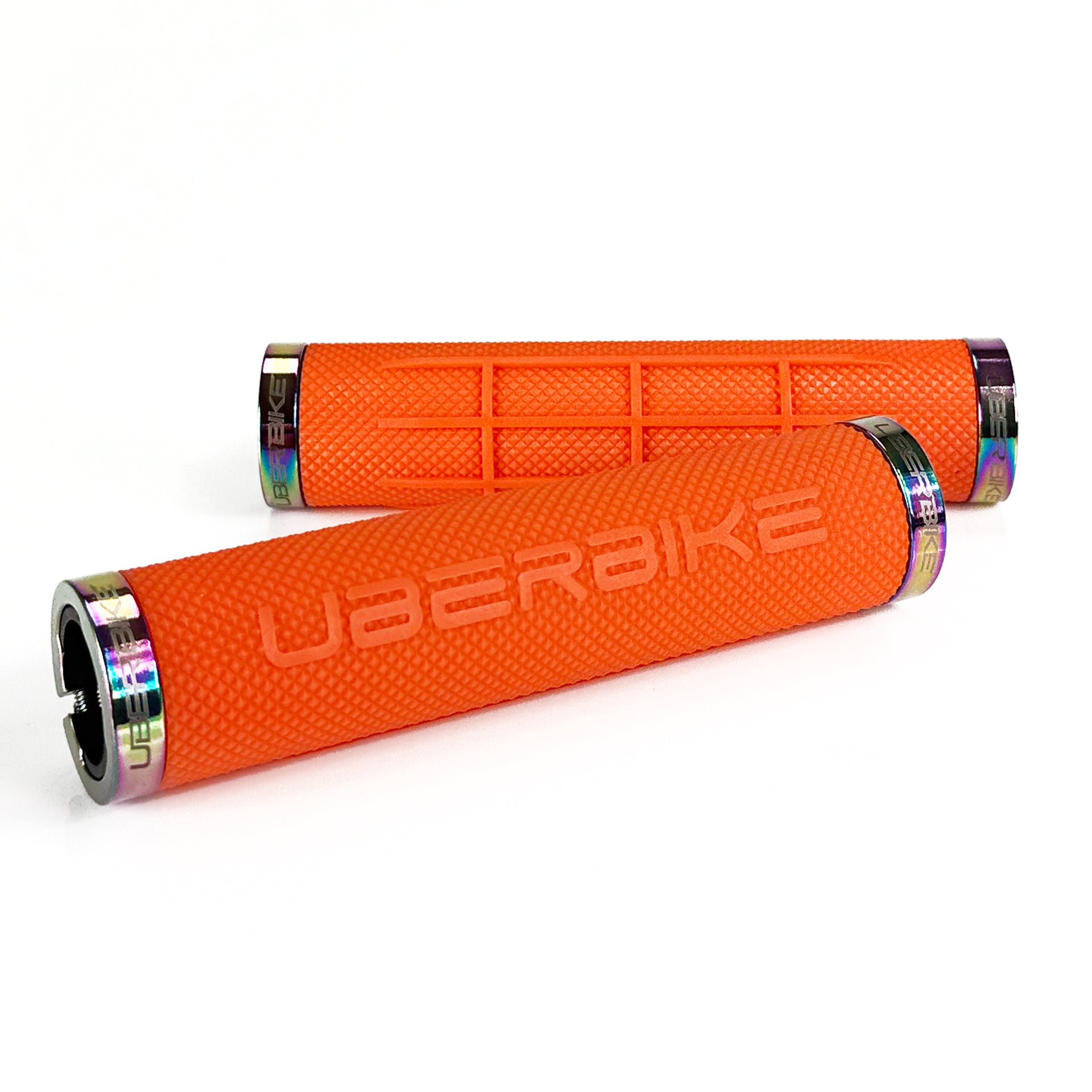 two orange fat grip mountain  bike grips and oilslick lockrings on a white background
