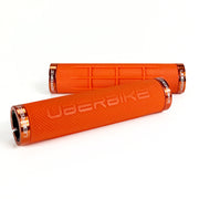 two orange fat grip mountain  bike grips and orange lockrings on a white background