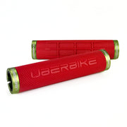 two red fat grip mountain  bike grips and green lockrings on a white background