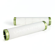 two white fat grip mountain  bike grips and green lockrings on a white background