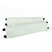 Two white bicycle handlebar grips with 'Uberbike' branding on a white background