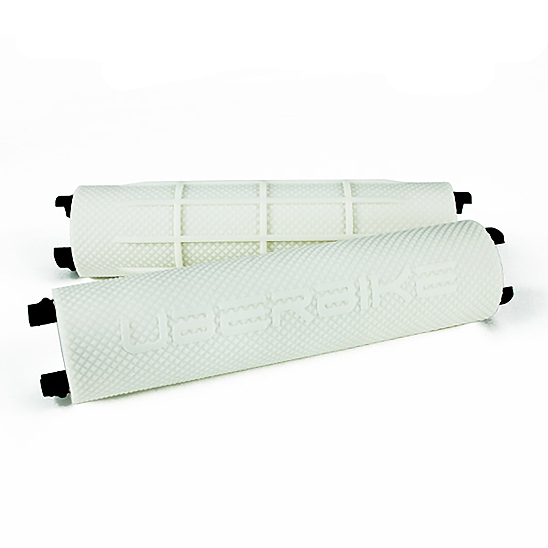 Two white bicycle handlebar grips with 'Uberbike' branding on a white background
