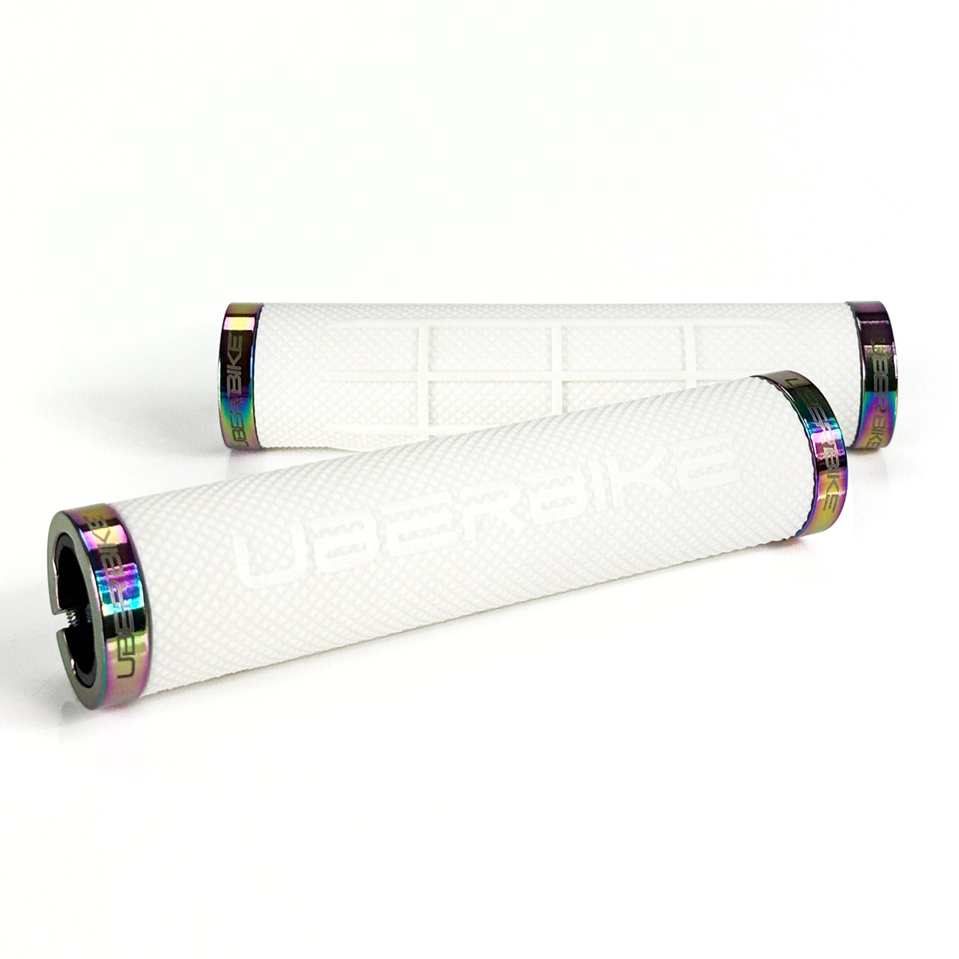 two white fat grip mountain  bike grips and oil slick lockrings on a white background