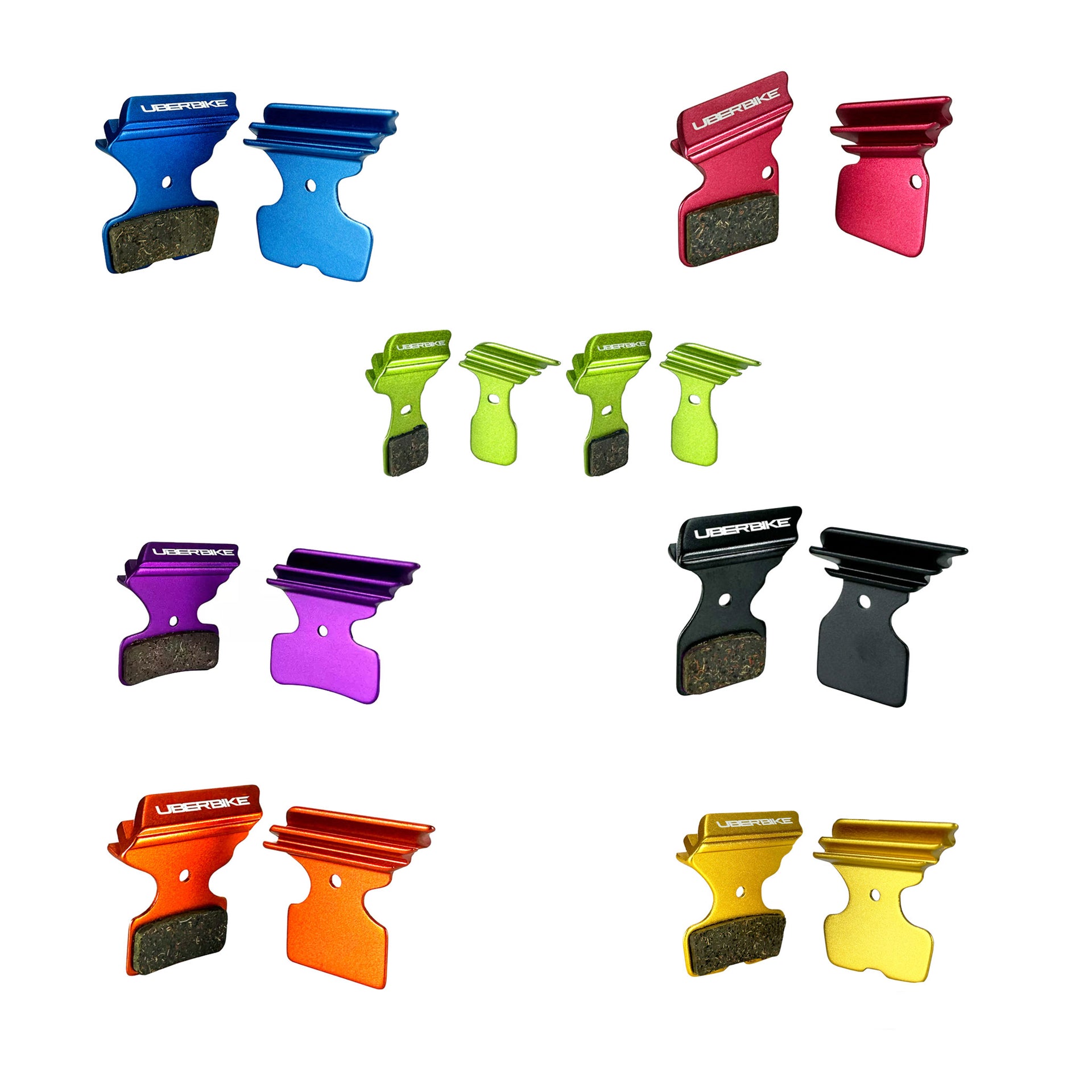 Different coloured finned disc brake pads on a white background
