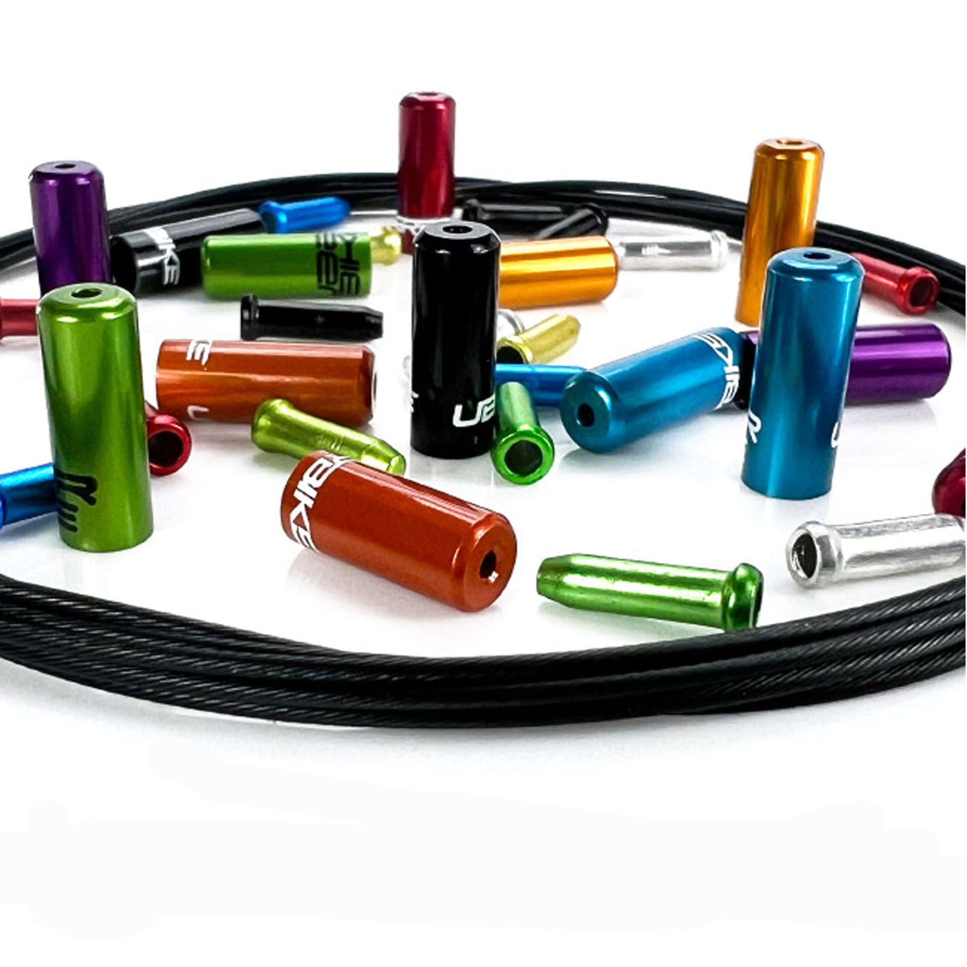 Close-up of mixed coloured sealed ferrules with endcaps and gear inner wire on a white background