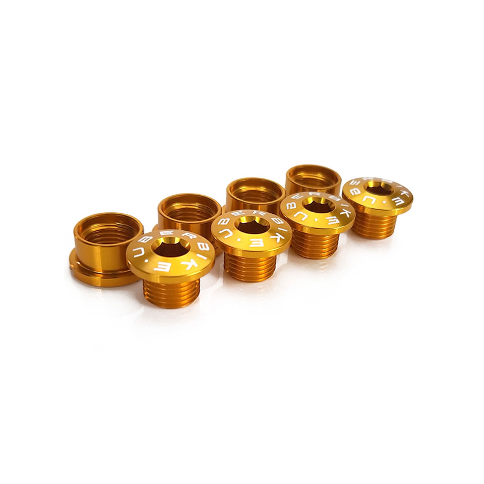 Gold chainring bolts with Uberbike branding on a white background