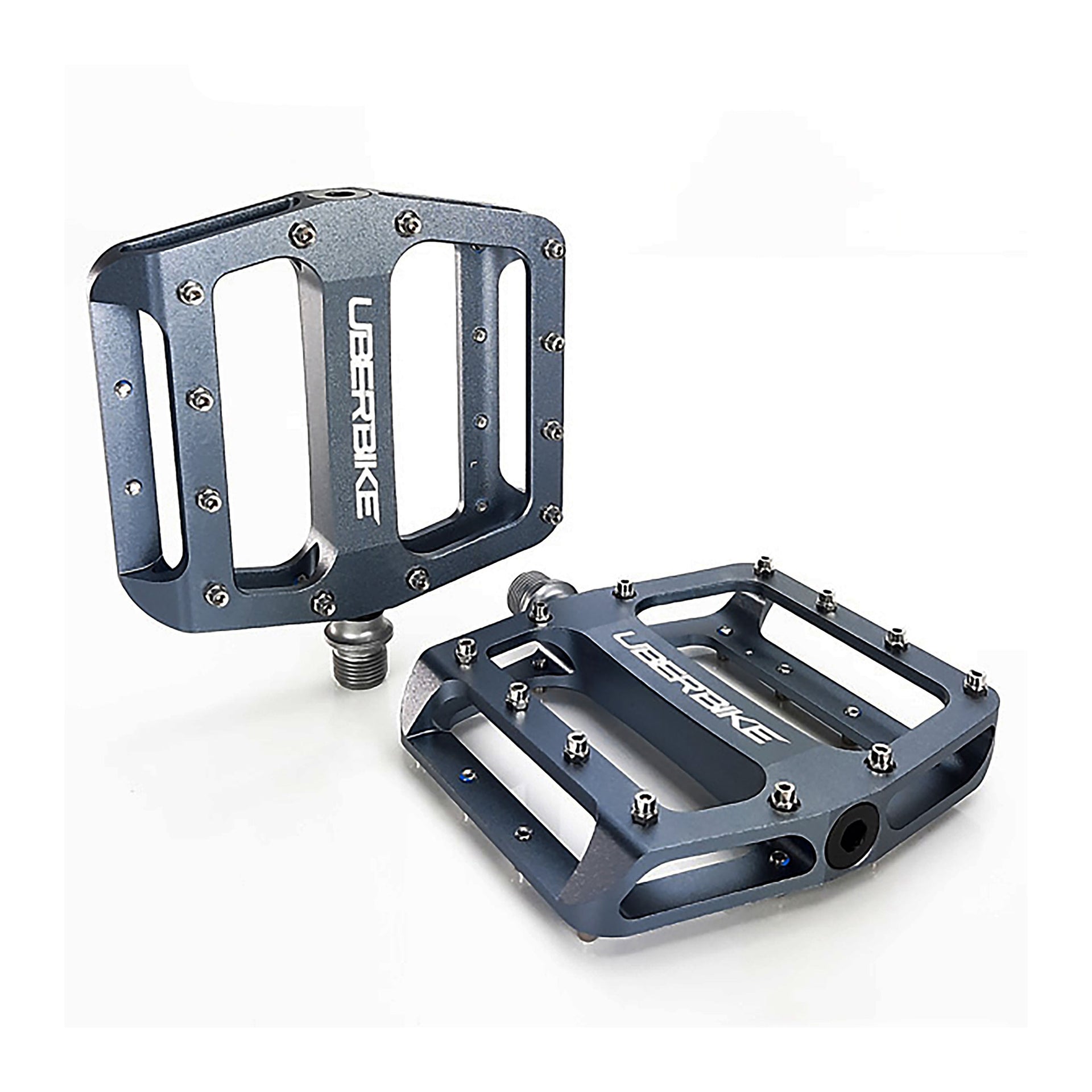 graphite flatout mtb pedals with Uberbike branding on a white background