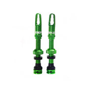 a pair of green wheel valves on a white backgroud