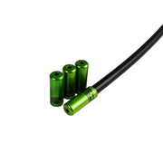 green Uberbike branded gear ferrules on a white background