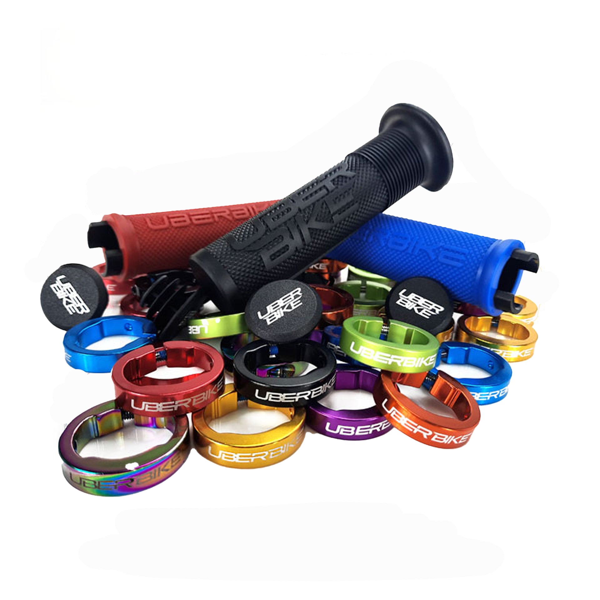 3 different coloured Uberbike branded grips on a pile of different coloured lockrings on a white background