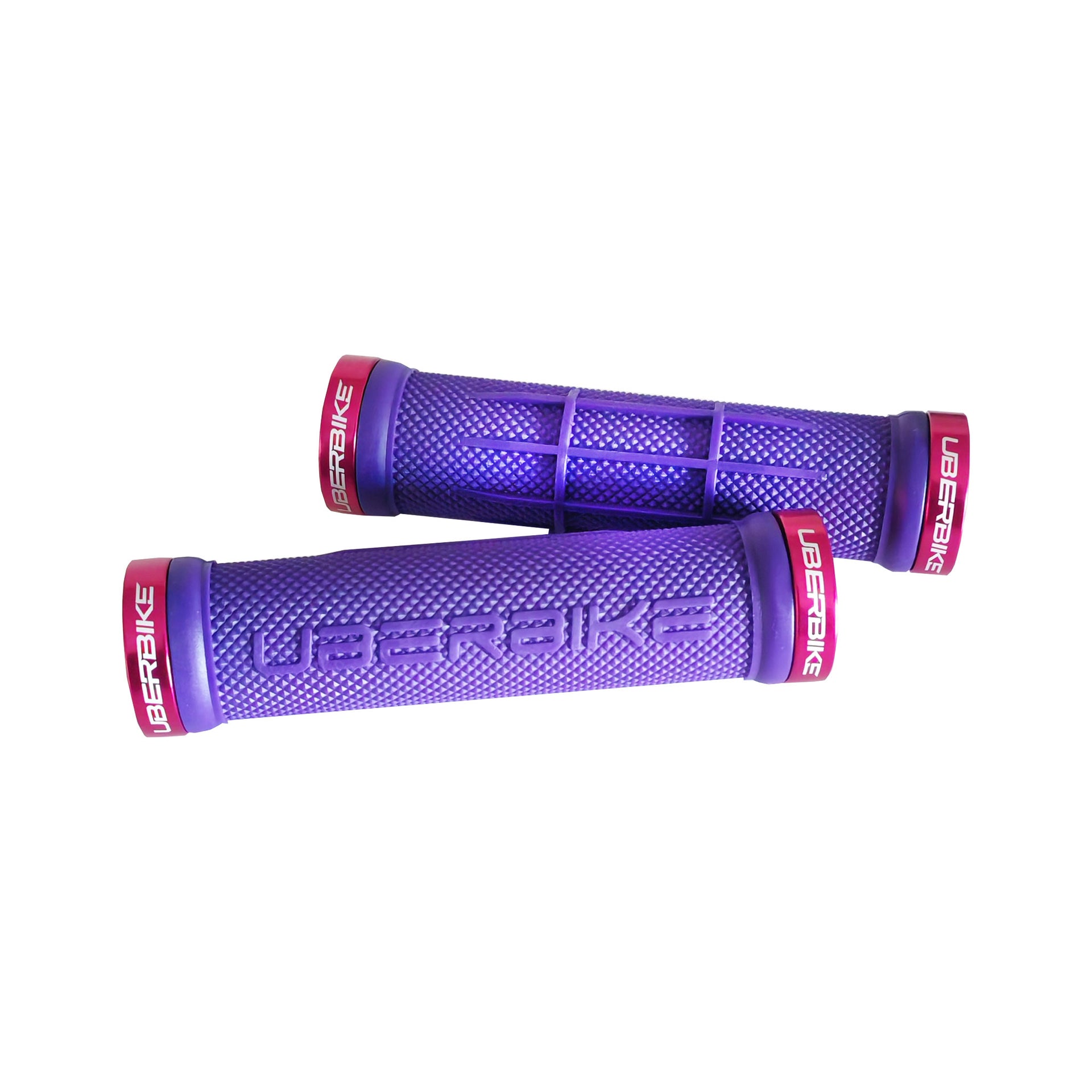 2 purple half waffle mountain bike grips with red lockrings and uberbike branding on a white background