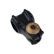 bronze headset top cap with a bronze bolt with uberbike branding on a white background