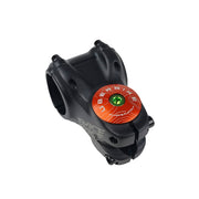 orange headset top cap with a green bolt with uberbike branding on a white background