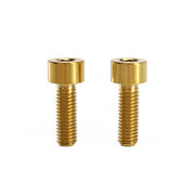 2 gold m5x15 cap head titanium bolts on a white background