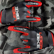 red mtb riding gloves with Uberbike branding