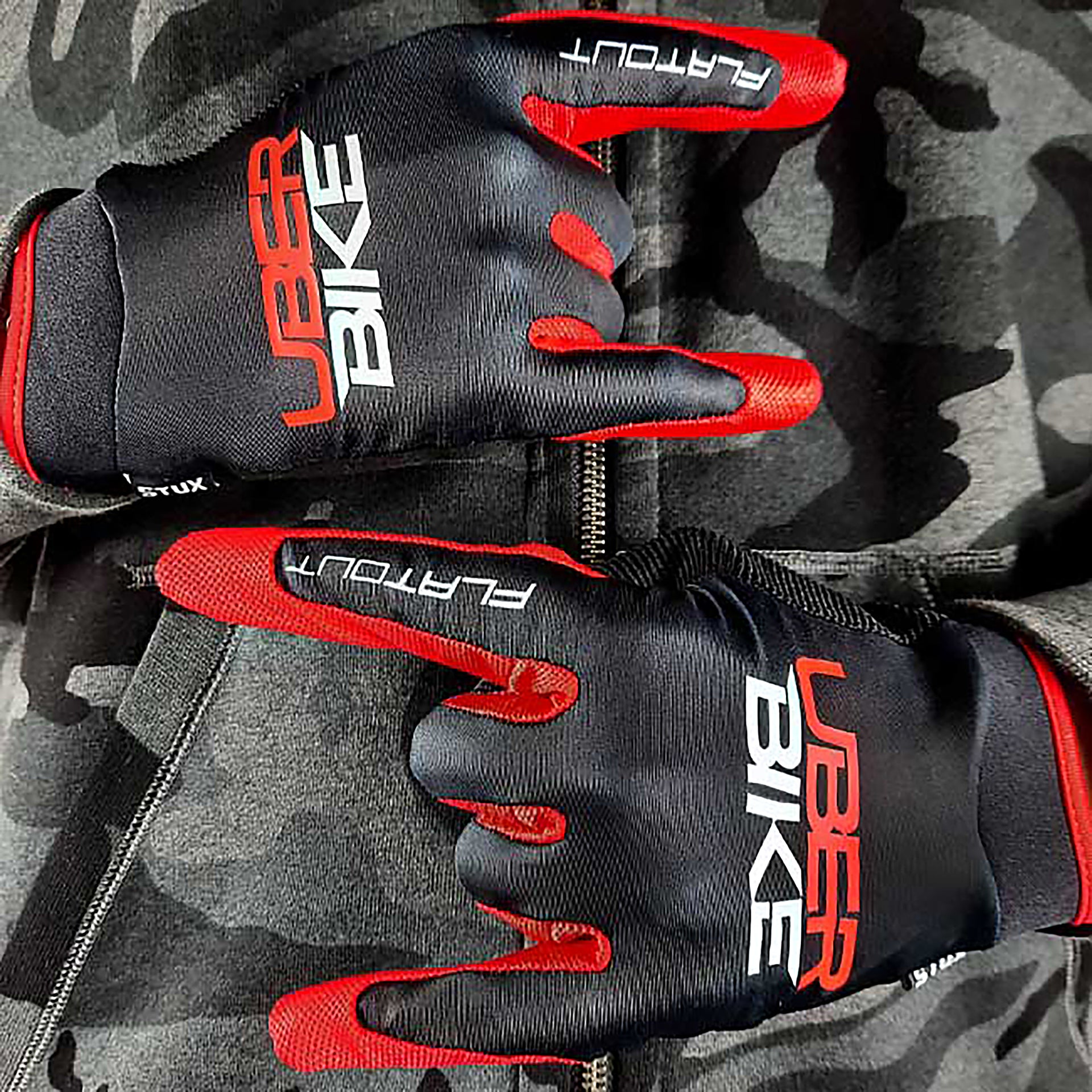red mtb riding gloves with Uberbike branding