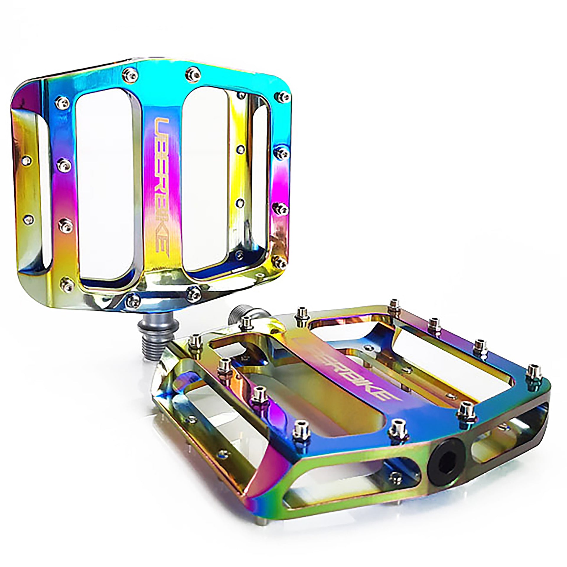 Uberbike branded Oil Slick pedals with raw pedal pins on a white background