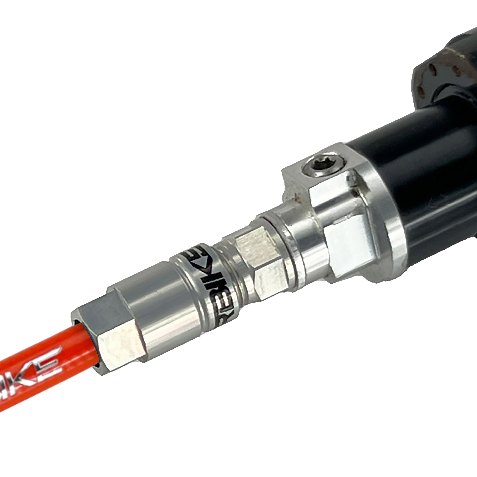 orange reverb hose installed in a dropper post on a white background