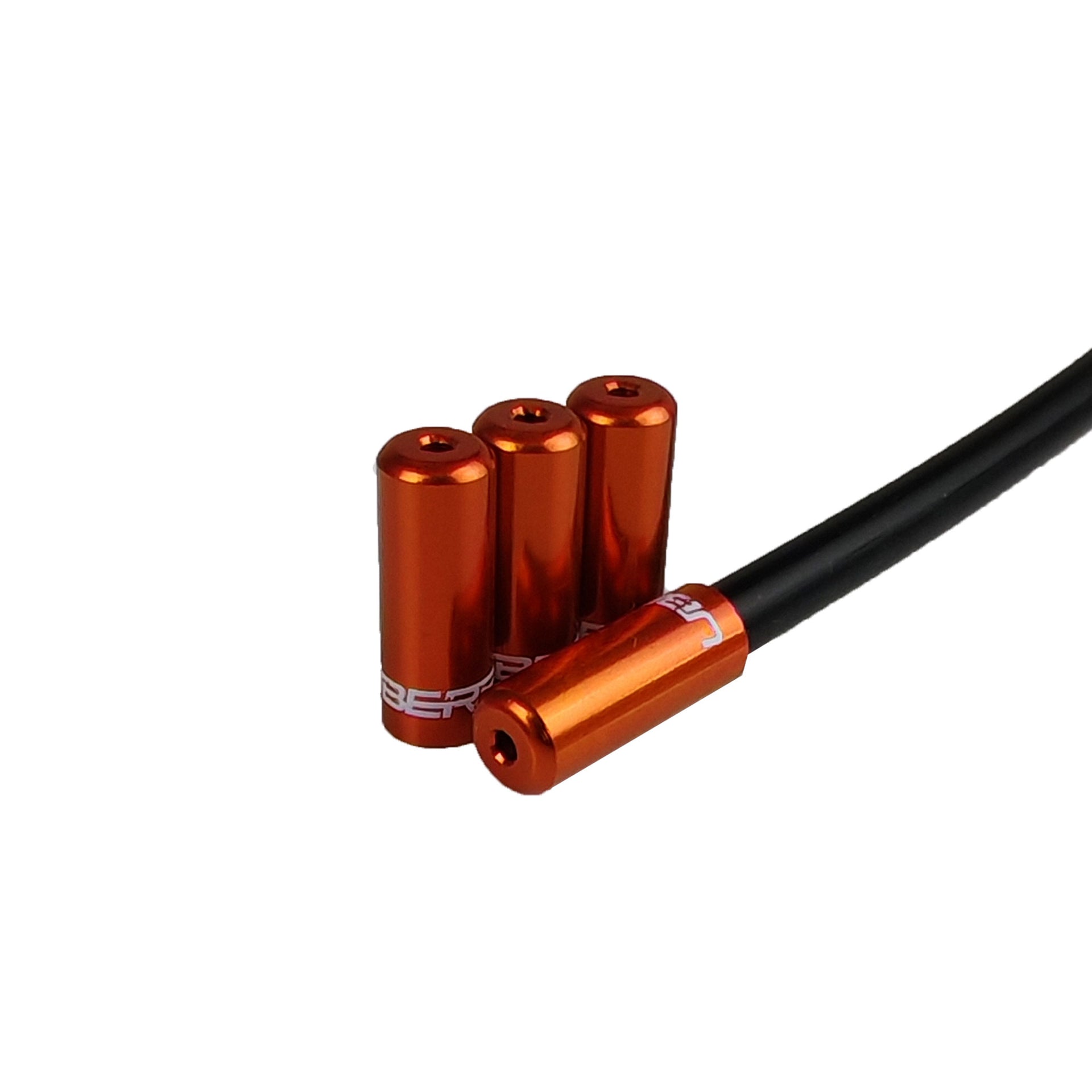 orange Uberbike branded gear ferrules on a white background