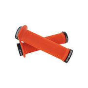 2 orange flange mountain bike grips with black lockrings and uberbike branding on a white background