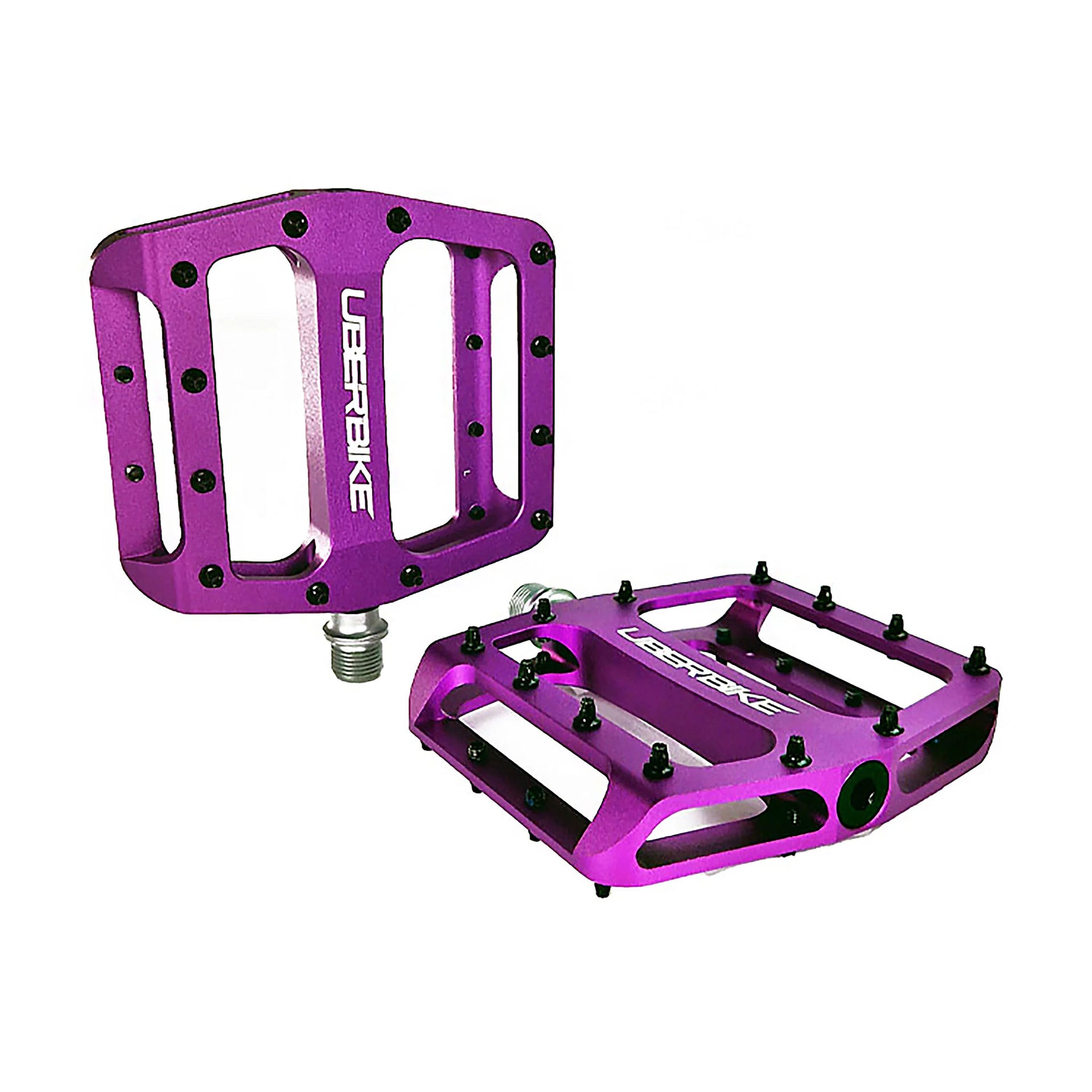 purple flatout mtb pedals with Uberbike branding on a white background