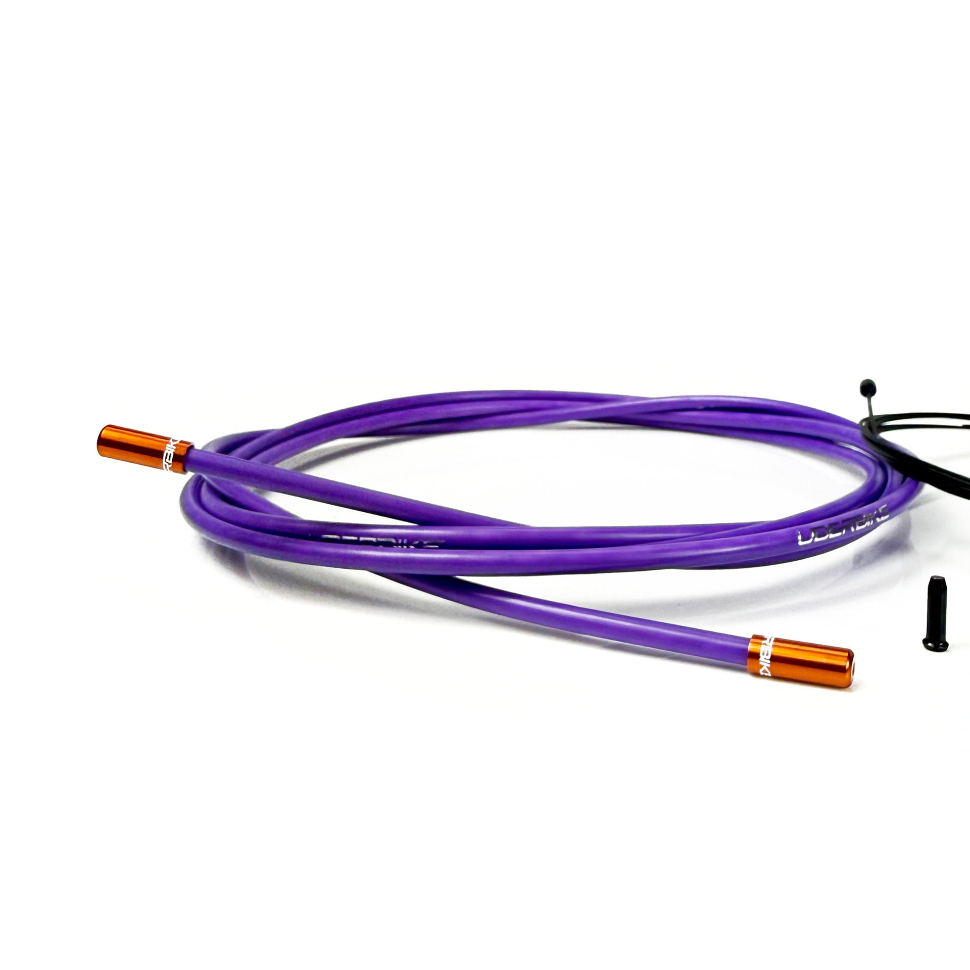 purple gear cable with orange sealed ferrules on a white background